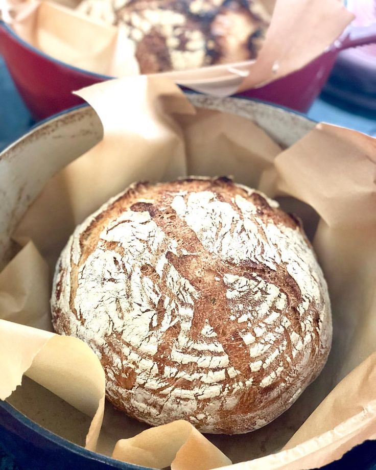 a loaf of bread sitting inside of a blue container