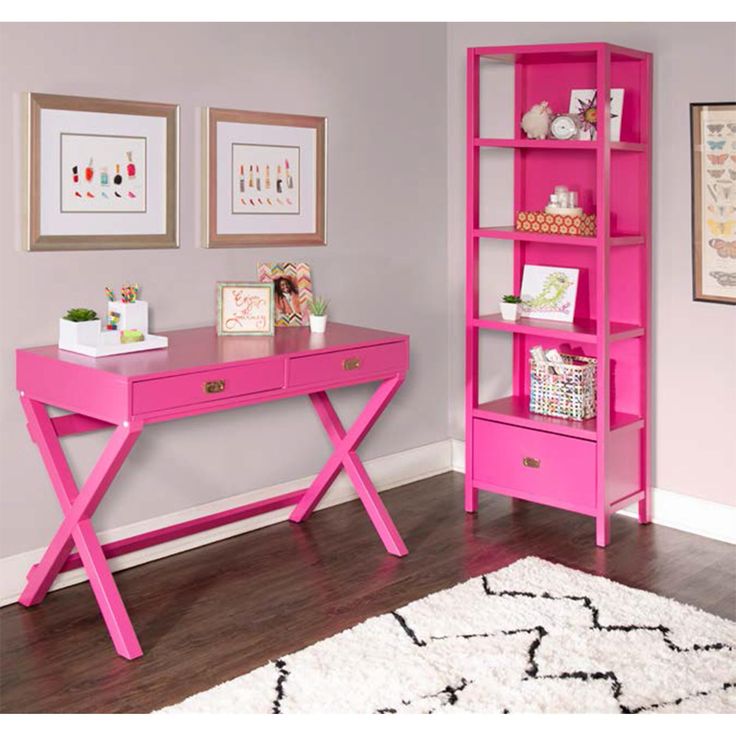 a pink desk and bookcase in a room