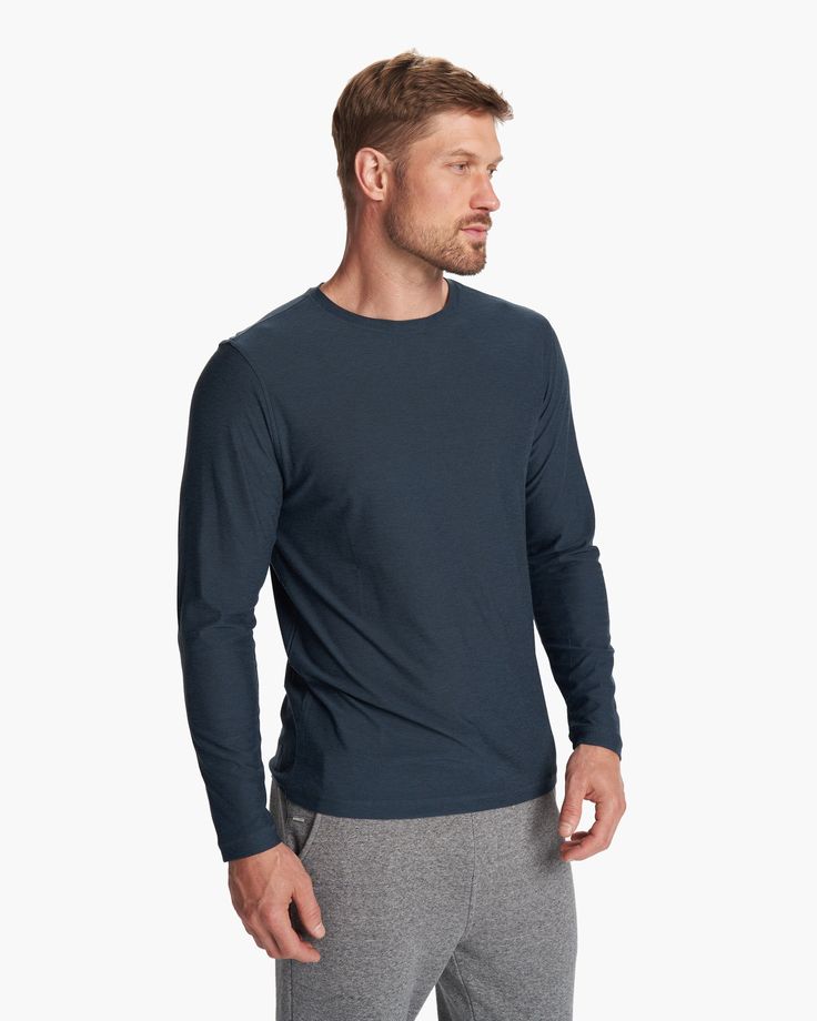 The Long Sleeve Strato Tech Tee is the softest piece of workout apparel on the planet, now doubling as your go-to long-sleeved must-have tee. With next-level comfort, our softest performance knit is moisture wicking with UPF 30+. | Vuori Long-Sleeve Strato Tech Tee | Navy Heather | Large Vuori makes premium performance apparel inspired by the active Coastal California lifestyle; an integration of fitness, surf, sport, and art. Breaking down the boundaries of traditional activewear, we are a new Navy Long Sleeve T-shirt, Sporty Long Sleeve Blue T-shirt, Sporty Navy Relaxed Fit T-shirt, Blue Long Sleeve Relaxed Fit T-shirt, Navy Long Sleeve Relaxed Fit T-shirt, Blue Long Sleeve Tops, Coastal California, California Lifestyle, Sweatshirt Shirt