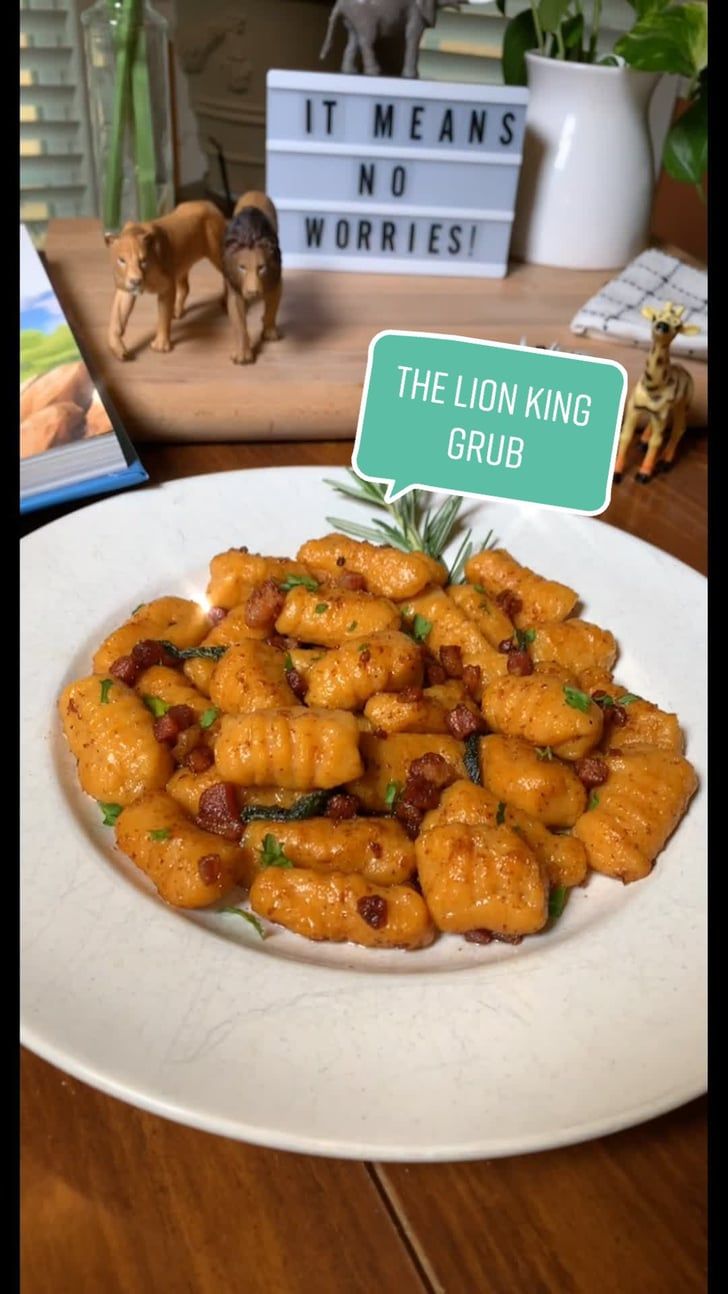 a white plate topped with fried food next to a sign that reads the lion king club