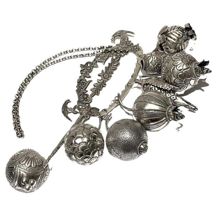 an assortment of silver items on a white background