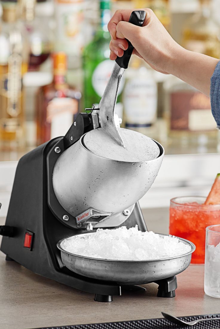 Person using ice crusher. Restaurant Kit, Pool Snacks, Snow Cone Syrup, Snow Cone Maker, Seafood Tower, Snow Cone Machine, Ice Shavers, Restaurant Supply Store, Commercial Kitchen Equipment