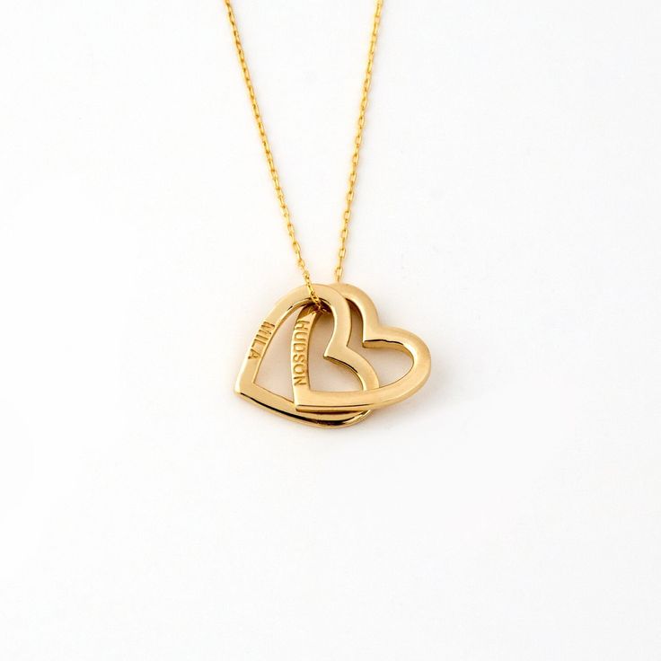 1- P R O D U C T ∙  D E S C R I P T I O N Made with meticulous craftsmanship, this delicate Engraved Two Heart Necklace in 14K Solid Gold is the epitome of timeless elegance. Perfect as a girlfriend gift, this dainty interlocking heart name necklace is a symbol of enduring love. Our 14k yellow gold necklaces for women are personalized, offering a unique touch to your everyday style. Experience luxury and sentimentality in one exquisite piece. 2- P R O D U C T ∙  D E T A I L S Gold material: 14K Engraved Yellow Gold Heart Necklace For Wedding, Personalized Double Heart Gold Plated Jewelry, Formal Yellow Gold Double Heart Necklace, Engraved Double Heart Jewelry For Anniversary Gift, Engraved Double Heart Jewelry For Anniversary, Gold Double Heart Necklace For Formal Occasion, Personalized Yellow Gold Double Heart Necklace, Personalized Heart Necklace In Yellow Gold-plated, Engraved Double Heart Necklace For Weddings