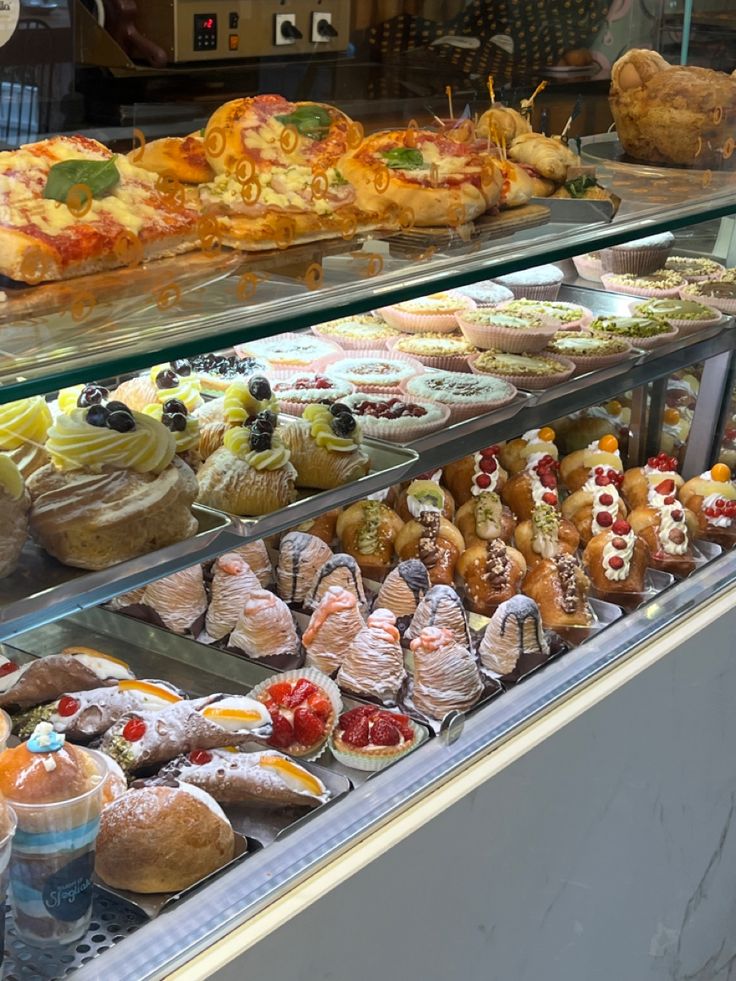 a display case filled with lots of different types of pastries