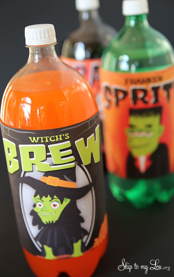 two bottles of beer with witches on the top and green, orange, and black labels