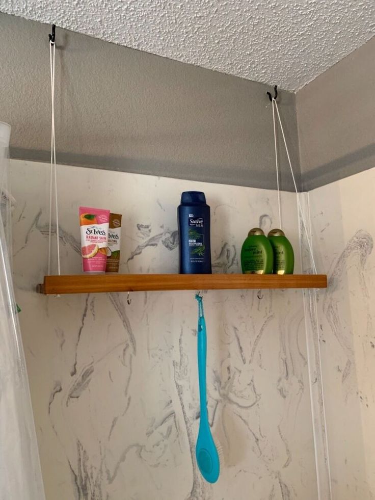 the bathroom is clean and ready to be used as a storage area for toothbrushes