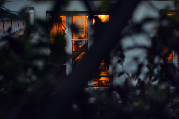 an open window at night with the light on