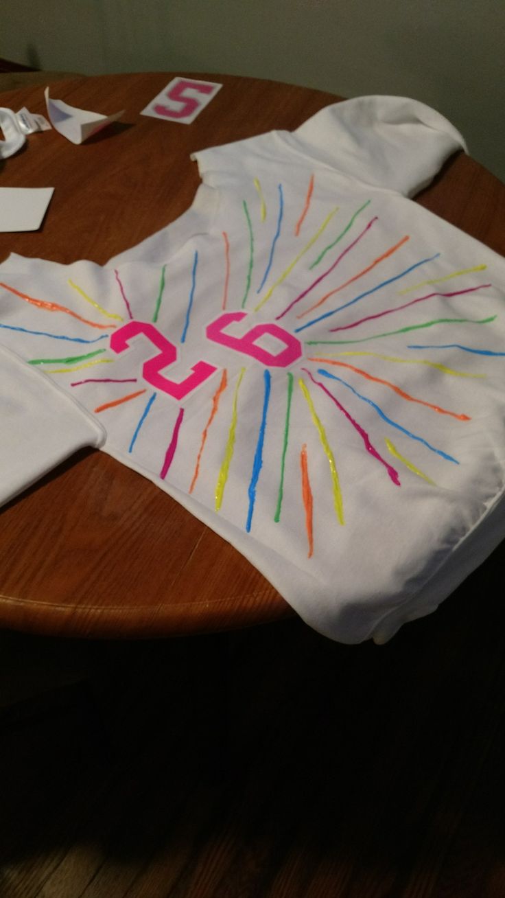 a child's t - shirt with the number twenty on it is sitting on a table