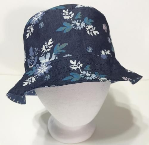 Bucket hat made of lightweight denim with blue and white floral print. Reverses to a blue and white polka dot print. Size MEDIUM, with 3-1/2 inch slot for ponytail. Foldable and lightweight to help keep you cool. Great for outdoor concerts, floating in the pool, yardwork, beach trips, resort stay or vacation travel. 100% cotton. Handmade in the USA. Hat With Flowers, Floral Bucket Hat, Gardening Hat, Denim Bucket Hat, Festival Hat, Outdoor Concert, Beach Trips, Fishing Women, Fishing Hat