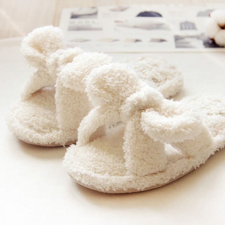 These fluffy mules are perfect for both indoor and outdoor wear during the winter and fall, offering non-slip protection and a thick sole for ultimate comfort. Cozy White Non-slip Slippers, Comfy Soft White Slippers, Comfy White Slippers With Soft Texture, White Fluffy Comfy Slippers, White Super Soft Comfy Slippers, Comfortable Fluffy White Slippers, White Casual Slippers With Soft Texture, Casual White Slippers With Soft Texture, Cozy Super Soft Slippers For Spring