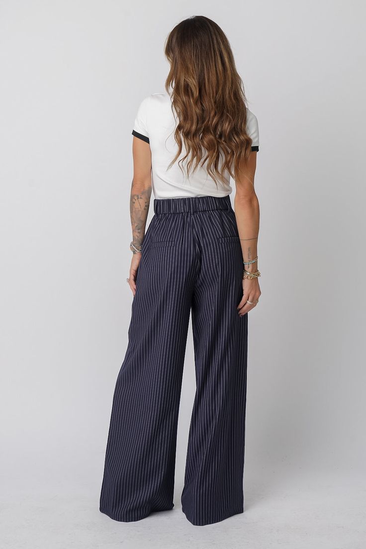 CRUZ Pants Style: Wide-leg, high-waisted trousers Color: Navy with pinstripes Inseam: 34” for size S (goes up 1” for each size) Closure: Button and zipper closure Waist: Stretchy, elastic waistband Fit: True to size. Size down if in between sizes Versatility: The classic design adds sophistication to any outfit, while the relaxed wide-leg fit ensures comfort without compromising style. Whether you're in the office, or stepping out for a dinner date, these pants bring a polished yet laid-back vib Navy Accents, Power Suit, Faroe Islands, Pants Style, Dinner Date, Stepping Out, High Waisted Trousers, Equatorial Guinea, Guinea Bissau