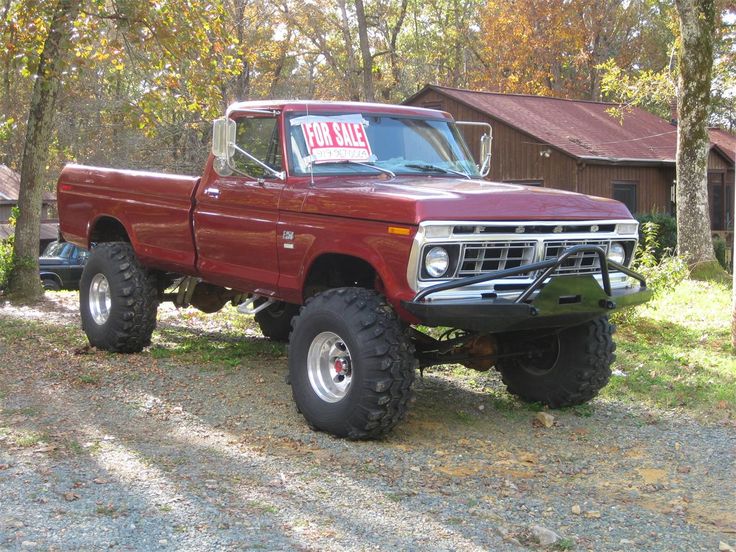 a red truck parked in front of a house