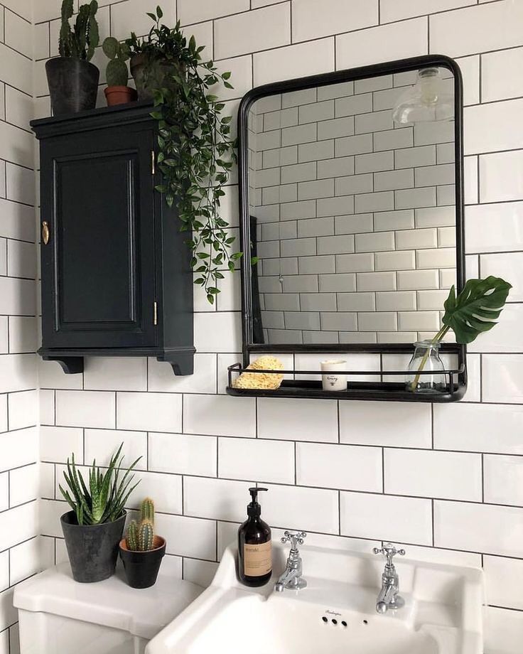 the bathroom is decorated in black and white