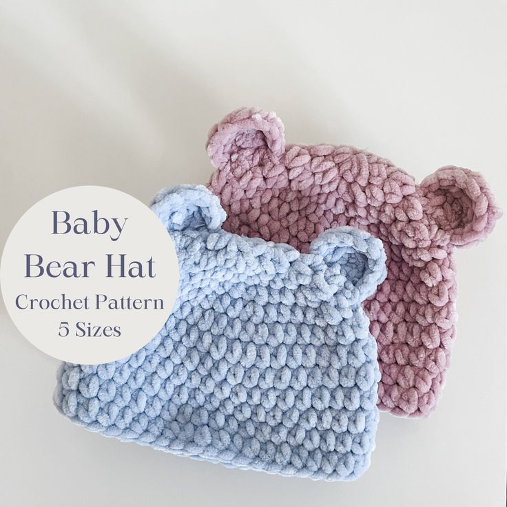 two crocheted baby bear hats on top of each other