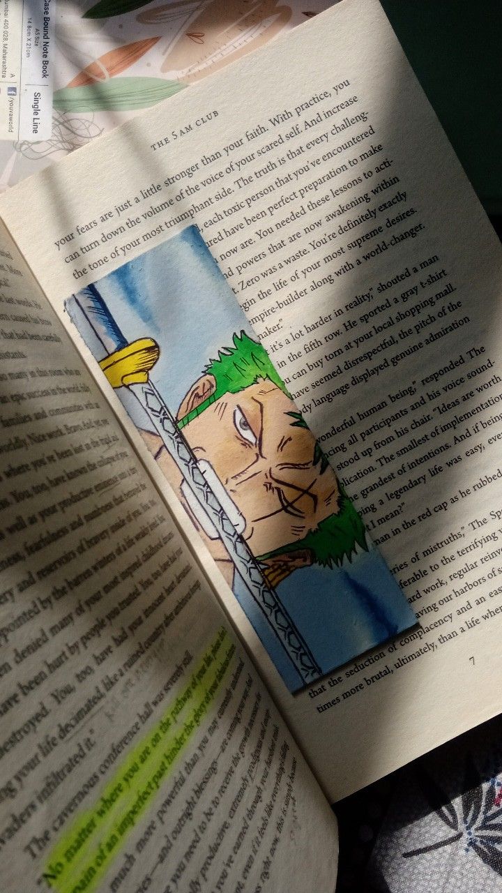 an open book with a cartoon character on it