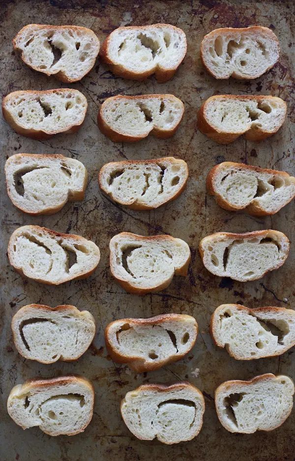 several pieces of bread that have been cut in half