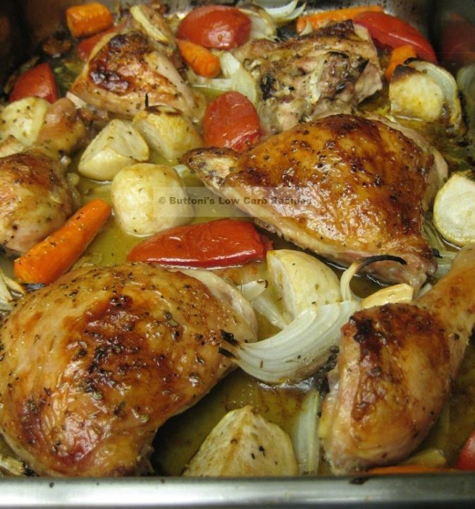 chicken, carrots and onions cooking in a pan