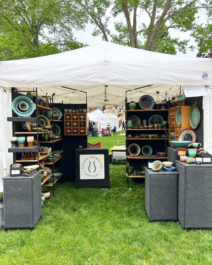 an outdoor tent with many different items on display