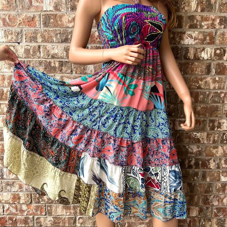 Our Smocked Ruched Patchwork Boho Dress Skirt is the ultimate fusion of style and functionality. Embrace the freedom of multiple fashion choices with this 2-in-1 masterpiece, effortlessly transforming from a captivating skirt to an alluring halter dress with ease.Crafted from exquisite rayon saree pieces, this dress exudes an irresistible flowy charm, perfect for embracing your bohemian spirit. Meticulously crafted from soft Indian Rayon fabric, this dress boasts a luxurious feel against your sk Bohemian Maxi Dress With Smocked Back And Tiered Skirt, Bohemian Maxi Dress With Gathered Skirt For Summer, Bohemian Dress With Smocked Back And Tiered Skirt, Bohemian Dress With Smocked Back And Flowy Skirt, Fitted Tiered Skirt Sundress, Bohemian Spring Maxi Dress With Gathered Skirt, Bohemian Maxi Dress With Gathered Skirt For Spring, Bohemian Dress With Flowy Gathered Skirt, Bohemian Dress With Gathered Flowy Skirt