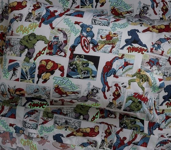 the back of a car seat covered in comic themed fabric