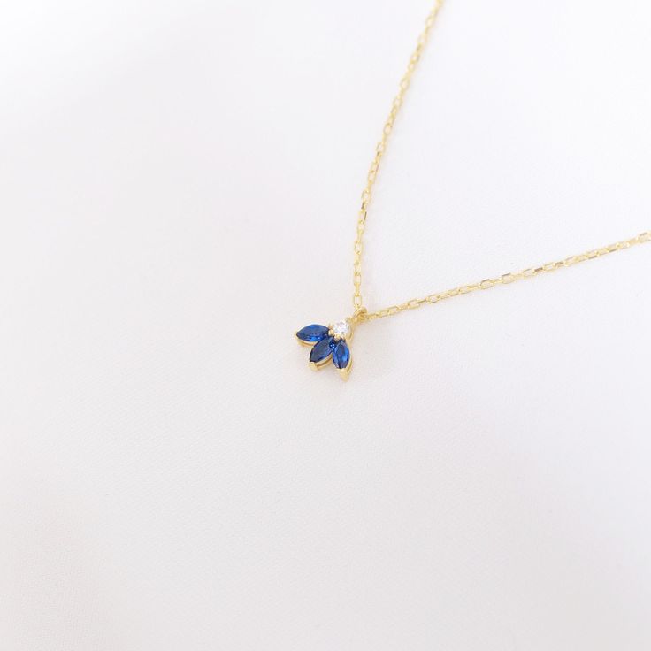 Your Sapphire Flower Pendant is stylish, dainty and pretty ideal for everyday use. Details of solid gold handmade Triple Sapphire Jewelry are very eye-catching. It is a great gift for your loved ones. This jewelry will be an indispensable piece of yours. This meaningful September Birthstone Necklace with high quality handwork will be a legacy you can leave to your family its. * Sapphire Lotus Necklace Details * Material / Gold Kt : This elegant necklace is made of 14k and 18k Solid Gold * Availa Blue Dainty Necklace With Clavicle Chain, Dainty Blue Clavicle Chain Necklace, Dainty Blue Jewelry For Party, Blue Birthstone Charm Necklaces As Gift, Blue Pendant Necklaces For Birthdays, Blue Birthstone Charm Necklaces For Gift, Blue Pendant Necklace For Birthday, Blue Pendant Necklaces For Birthday, Elegant Blue Jewelry For Birthday Gift