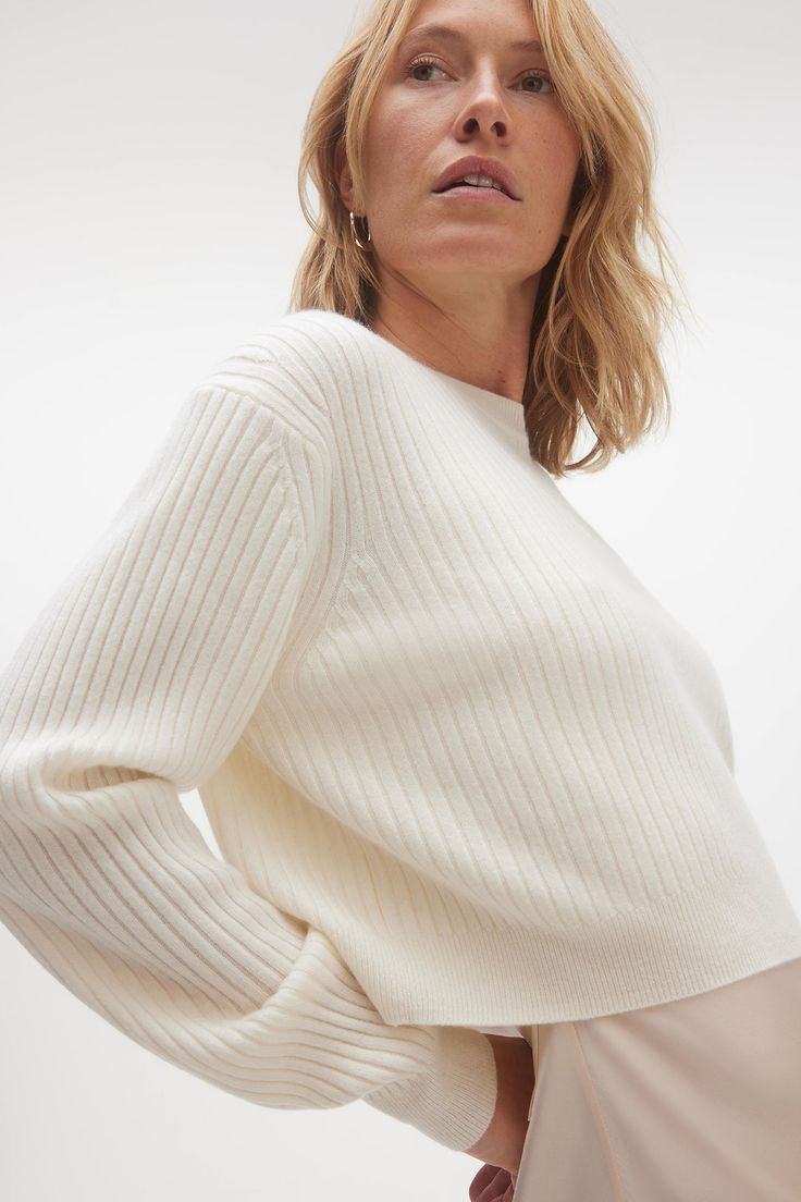 The Nova ribbed crewneck is the go-to for a luxe lounge look. Complete the set with the Keira ribbed shorts. 246 grams of 100% pure cashmere in 12-gauge knit Crewneck sweater Cropped Ribbed throughout 19" length (size small) Dry Clean Only All sale items are FINAL SALE. White Sweater Blank, Knit Sweaters Cropped, White Cropped Sweaters, Luxury Casual Cashmere Cropped Sweater, Cropper Knit Sweaters, White Cropped Knit Sweater, Cashmere Sweater White, Rib Knit Sweater, Luxe Lounge