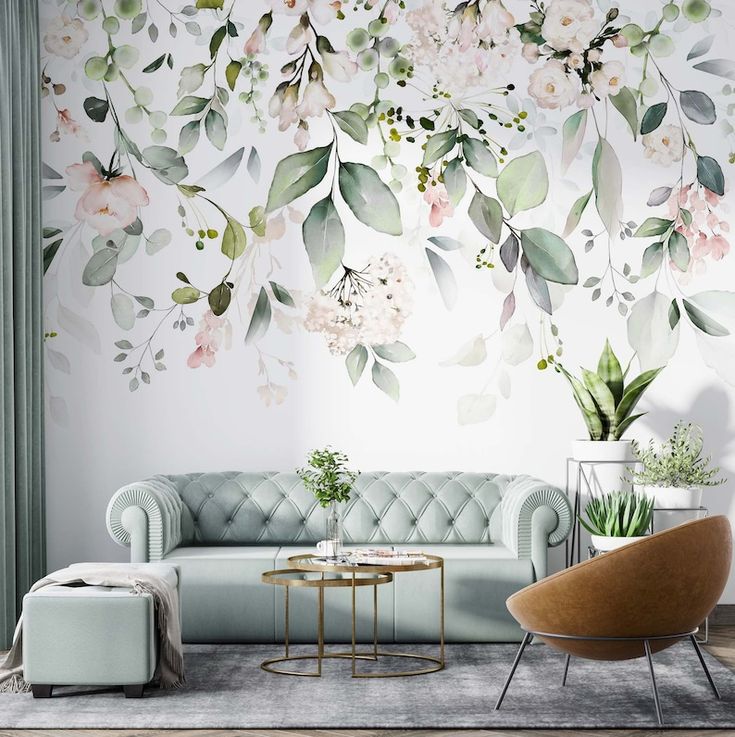 a living room with flowers painted on the wall