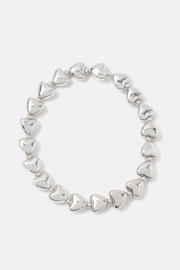 Give your look a little love with this chic EVEREVE bracelet, featuring silver-tone heart beads and stretch elastic for easy on-and-off. Wear it alone, or add it to a layered look with a chain bracelet. Cheap Round Bracelets With Heart Beads, Silver Stretch Bracelet With Heart Beads For Valentine's Day, Silver Stretch Bracelet With Heart Beads, Trendy Silver Heart Beads Bracelet, Silver Heart Charm Stretch Bracelet, Silver Stretch Bracelet With Heart Charm, Silver Stretch Bracelet For Valentine's Day, Adjustable Silver Stretch Bracelet With Heart Beads, Silver Heart Bracelet