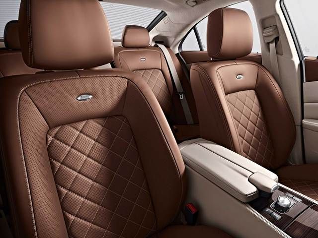 the interior of a car with brown leather seats