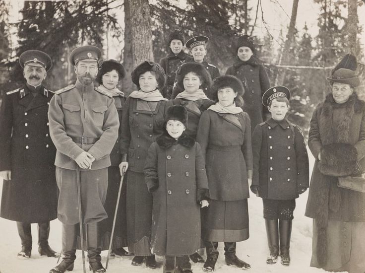 an old black and white photo of people standing in the snow