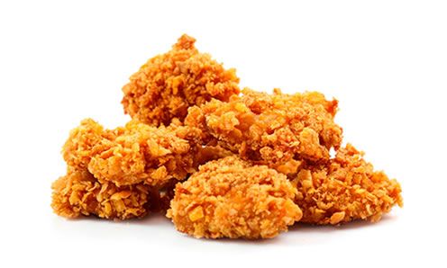 some fried food sitting on top of a wooden table