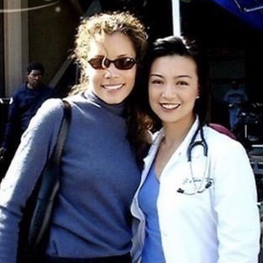 two women standing next to each other with a stethoscope on their shoulder