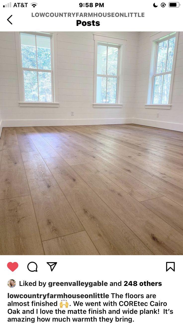 an empty room with white walls and wood flooring is featured on the instagram