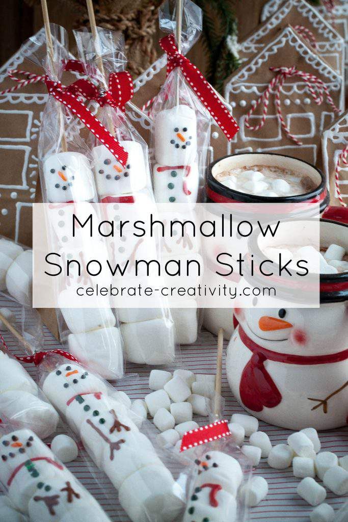 marshmallow snowman sticks are arranged on a table