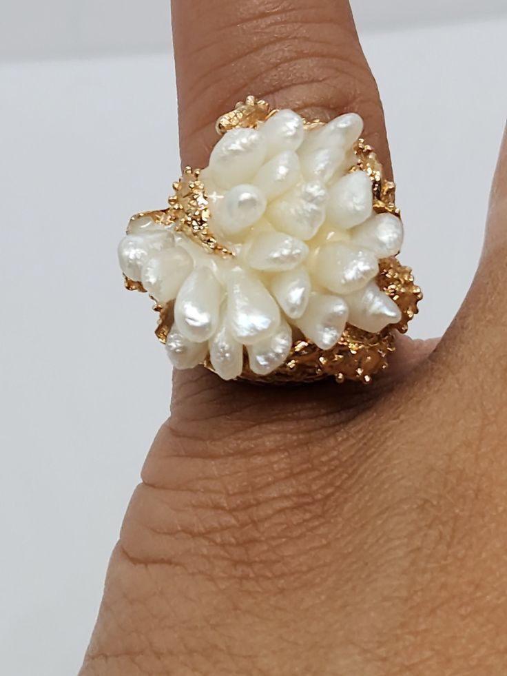 You are viewing a beautiful 14k solid gold biwa pearl ring . The ring size is 3 1/4 very small size but can resize up. The ring marked 14k inside. The ring itself measures approx.20mm x21mm The total weight of the ring is 13.81 grams  This ring is pre owned but really.good condition . Its definitely very unique design ring. Its a perfect gift for your loveones. Luxury Unique Pearl Ring Gift, White Pearl Drop Ring For Anniversary, Luxury White Rings With Pearl Drop, Formal White 14k Gold Pearl Ring, Luxury Pearl Ring For Gift, Luxury White Pear Shaped Rings, White Pearl Drop Ring Jewelry, Unique Pearl Jewelry For Anniversary, White High Luster Pearl Ring For Wedding