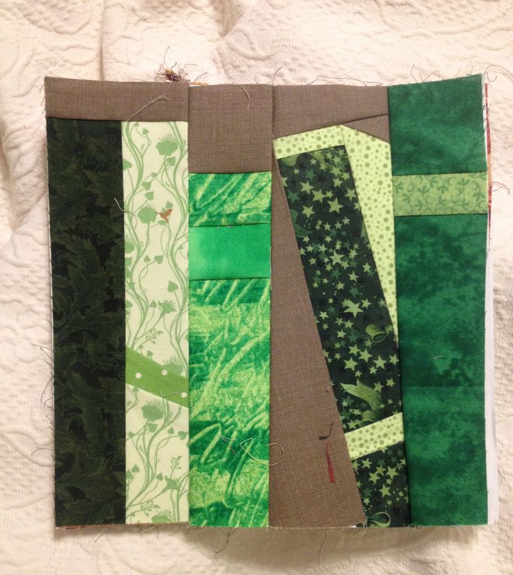 a close up of a piece of fabric with green and brown strips on it's sides