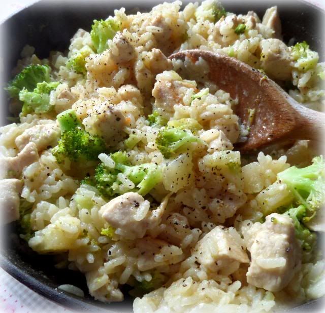 chicken and rice with broccoli in a skillet