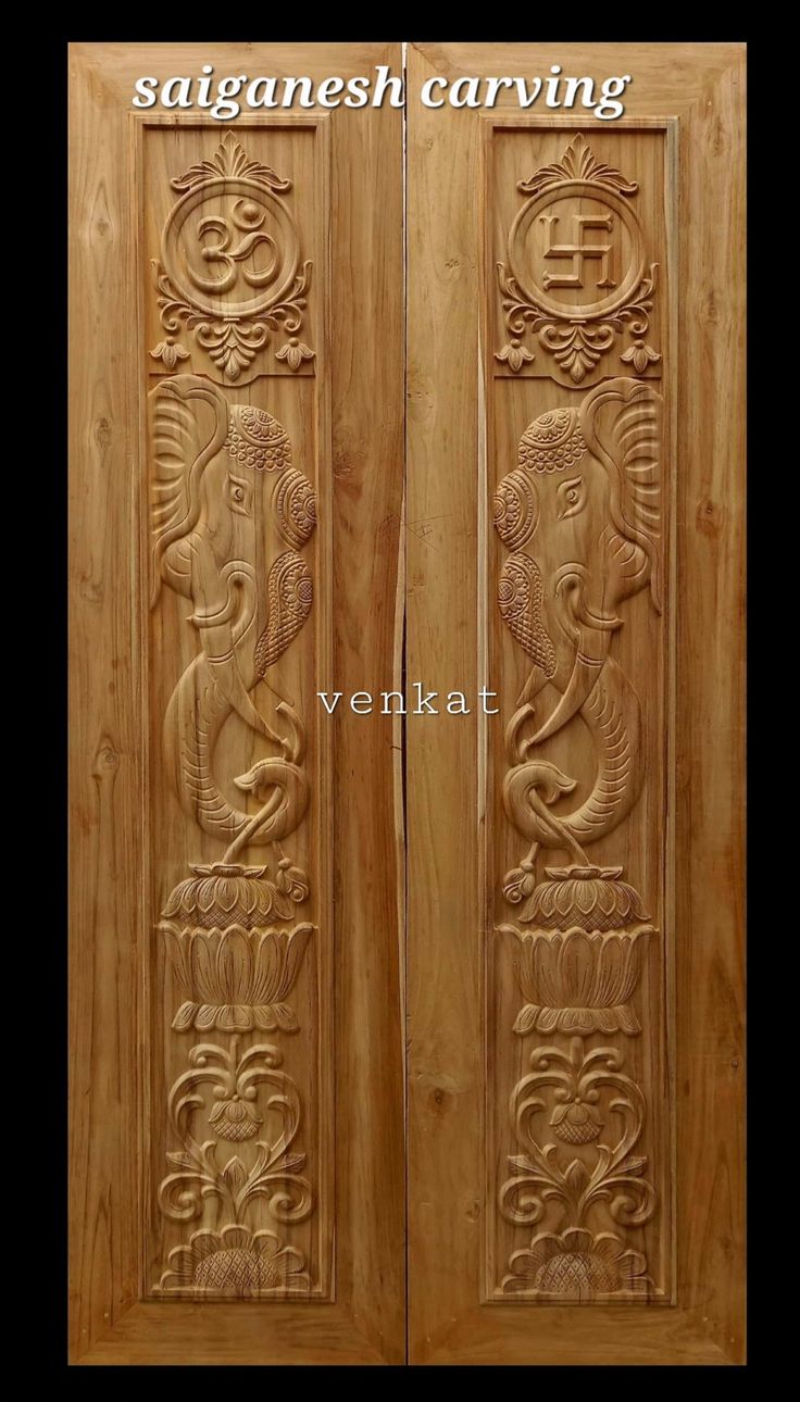 two wooden doors with carvings on them and the words saganesh carving above it