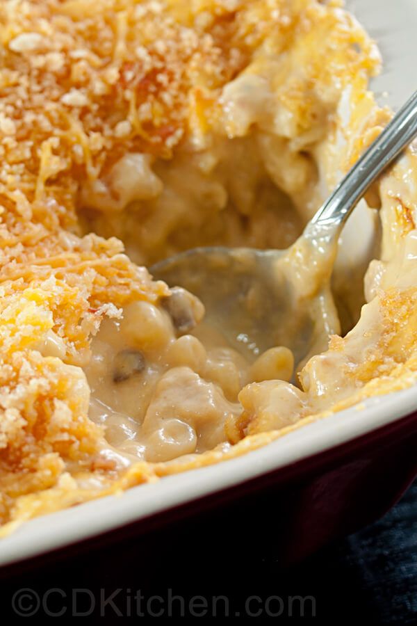 a casserole dish filled with macaroni and cheese covered in gravy