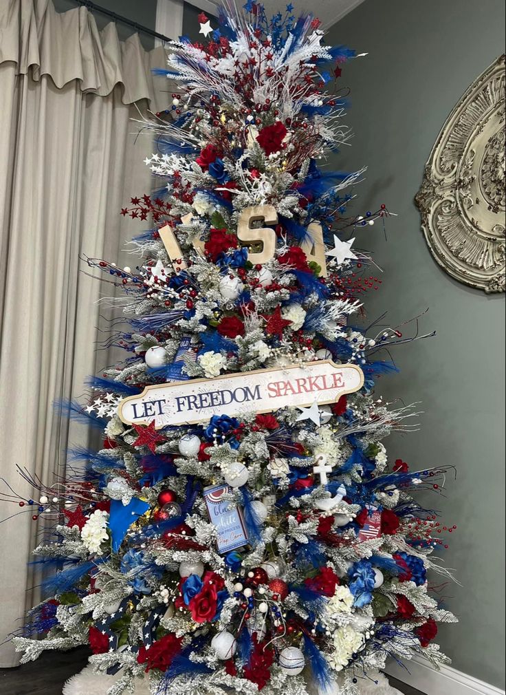 a decorated christmas tree with red, white and blue decorations