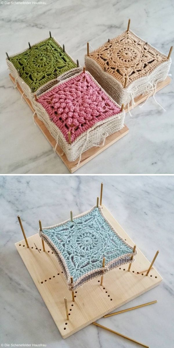 three different colored crocheted squares sitting on top of a wooden tray with knitting needles