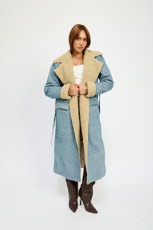 Denim maxi coat layered with shearling and accents at collar and sleeves. Removable tie at waist. Warm and chic for the cold days!Model is 5.9, wearing S. Recommended siing 2-4 S, 6 M, 8-10 L Fabric Contents: 90% COTTON, 10% POLYESTERCONTRAST: 100% POLYESTERLINING: 100% POLYESTER Fall Denim Belted Outerwear, Winter Denim Long Coat, Chic Denim Winter Outerwear, 4th Of July Dresses, Plus Jumpsuit, Denim Trench Coat, Cardigan Sweater Coat, Maxi Coat, Denim Maxi