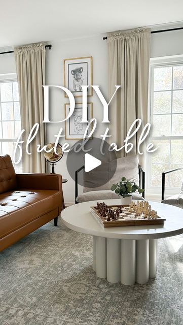 a living room filled with furniture and a table in front of a window that says diy life style