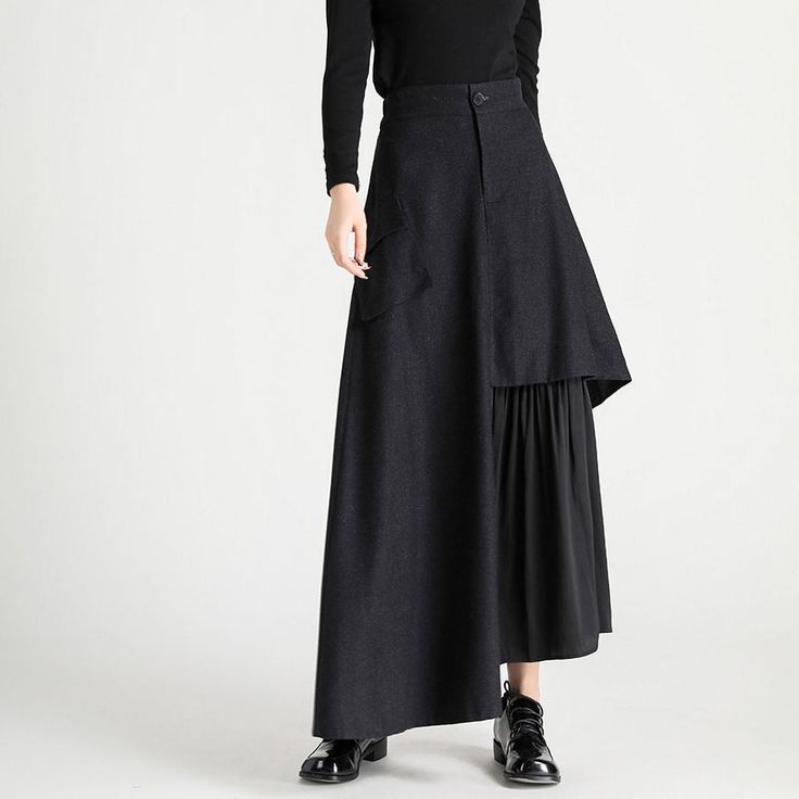 A long docking skirt with different fabrics spun together at the hem. It has a slender silhouette from the waist to the hips, but has a loose design that widens at the hem. The fragrant "black" makes its presence stand out. 
 
 
 Size 
 
 S size 
 
 Total length: 94cm 
 Waist: 64-68cm 
 Hip: 104cm 
 
 M size 
 
 Total length: 95cm 
 Waist: 68-72cm 
 Hip: 108cm 
 
 L size 
 
 Total length: 96cm 
 Waist: 72-76cm 
 Hip: 112cm 
 
 XL size 
 
 Total length: 97cm 
 Waist: 76-80cm 
 Hip: 116cm Black Patchwork Tiered Skirt, Black Tiered Patchwork Skirt, Fall Patchwork Asymmetrical Skirt, Black Asymmetrical Skirt With Layered Hem, Black Asymmetrical Hem Pleated Maxi Skirt, Black Pleated Maxi Skirt With Asymmetrical Hem, Black Asymmetrical Voluminous Maxi Skirt, Black Asymmetrical Gathered Maxi Skirt, Black Voluminous Asymmetrical Maxi Skirt