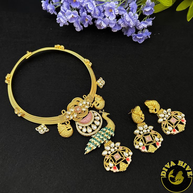 Gorgeous fusion hasli fully handmade with a beautiful peacock ,pachi kundan, navratan and carved stones. Metal : Brass with 92.5 silver coated Contain : Hasli , Earring Perfect for all occasion(Party, Wedding ,Engagement) Highest quality and craftsmanship Nickel Free Polish : Gold Handcrafted Free US standard shipping Ready to ship from New Jersey , United States CARE Store them in moisture free areas and keep them away from water and liquid fragrances Peacock Design Jewelry For Diwali, Fusion Temple Necklace With Meenakari Chandbali, Festive Fusion Style Kundan Necklace With Meenakari, Kundan Jewelry Sets For Puja, Fusion Meenakari Jewelry For Diwali, Handmade Kundan Jewelry Sets For Diwali, Fusion Style Meenakari Jewelry For Diwali, Fusion Kundan Jewelry Sets With Meenakari, Navratri Festive Jewelry With Peacock Design