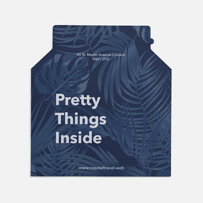 the packaging for pretty things inside is blue and has palm leaves on it, as well as