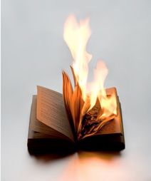 an open book with flames coming out of it