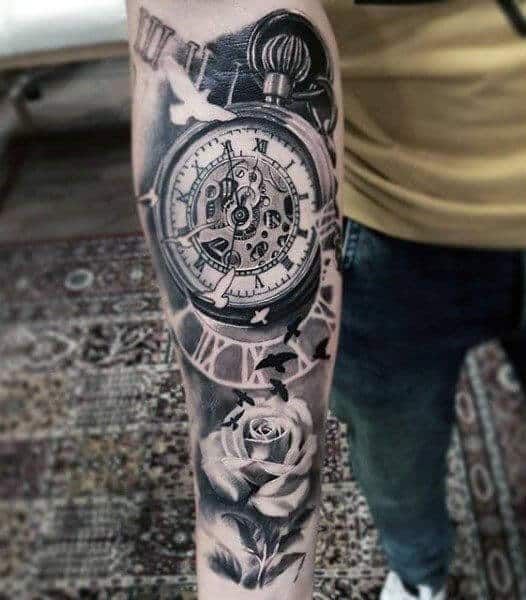 a man with a clock and roses tattoo on his arm