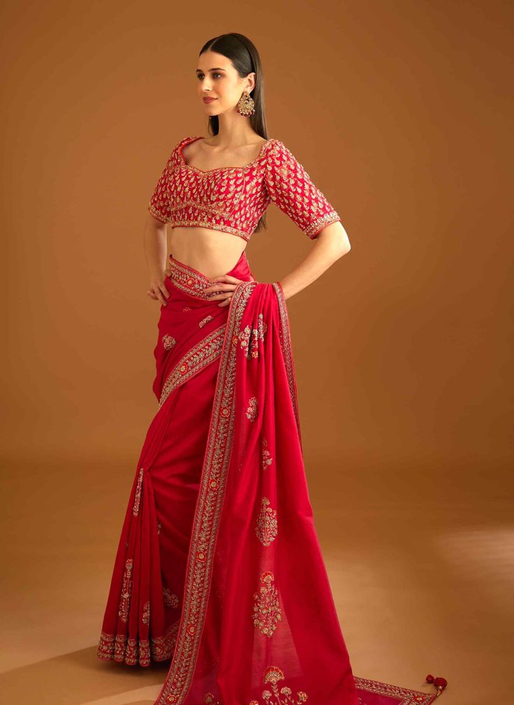 Editor's Note The combination of a red brocade blouse with zardozi embroidery and a silk chanderi sari with zardozi embroidery creates a stunning traditional look. The blouse adds a pop of bold color with intricate detailing, while the sari adds elegance with delicate embroidery. Color: Red Fabric: Silk and chanderi Embroidery details: Zardozi embroidery Components: Sari & blouse Sari length: 6 meters, sari width: 46" inches Occasion: Engagement and wedding guest Disclaimer: Product color may sl Red Brocade Blouse, Bridal Entry, Blouse Sari, Blouse Yoke, Zardozi Embroidery, Brocade Blouse, Personal Shopping Service, Brocade Blouses, Delicate Embroidery