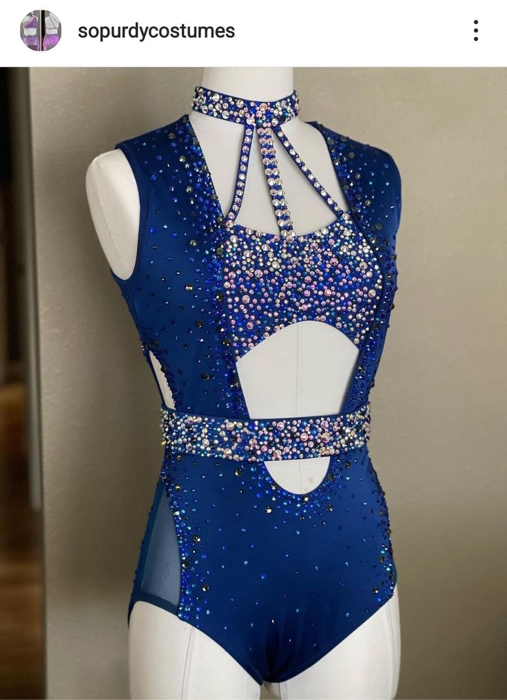 a blue leotard with beads on it